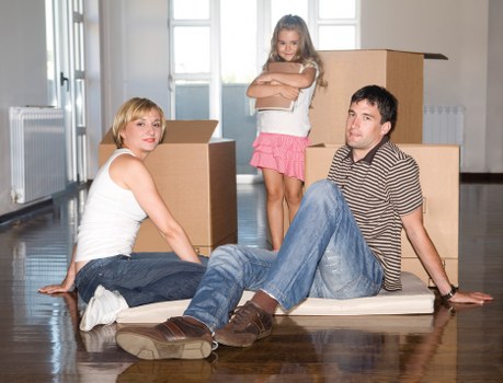 Professional packers carefully handling fragile items